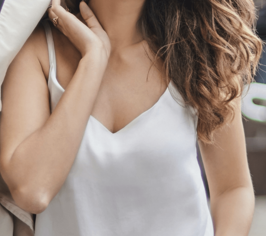 woman wearing a white silk camisole